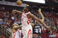 Mar 30, 2019; Houston, TX, USA; Houston Rockets center Clint Capela (15) and forward PJ Tucker (17) and Sacramento Kings guard Corey Brewer (33) reach for a rebound in the second half at Toyota Center. Mandatory Credit: Thomas B. Shea-USA TODAY Sports