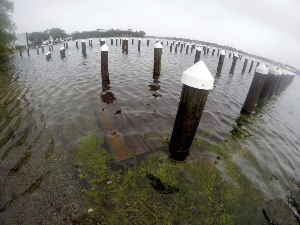 <p>Many docks and boat ramps like this one on Cinco Bayou are submerged in water due to flooding from Hurricane Nate on Sunday, Oct. 8, 2017, in Fort Walton Beach, Fla. (Photo: Nick Tomecek/Northwest Florida Daily News via AP) </p>