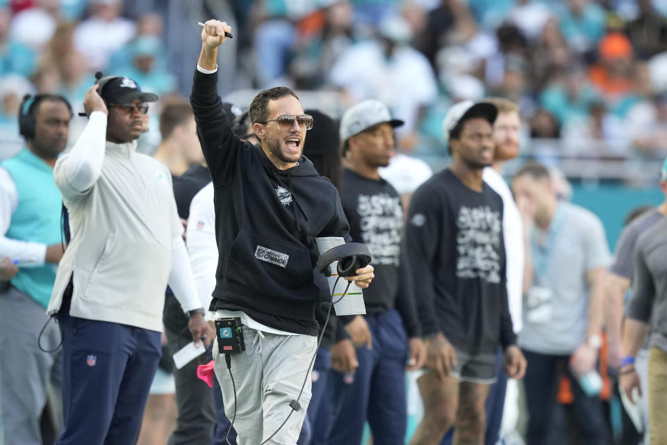 Miami Dolphins head coach Mike McDaniel gestures during the first half of an NFL football game New York Jets, Sunday, Dec. 17, 2023, in Miami Gardens, Fla. (AP Photo/Rebecca Blackwell)