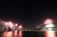 SYDNEY, AUSTRALIA - DECEMBER 31: Fireworks light up the sky during the nine o'clock show during New Years Eve celebrations on Sydney Harbour on December 31, 2012 in Sydney, Australia. (Photo by Cameron Spencer/Getty Images)