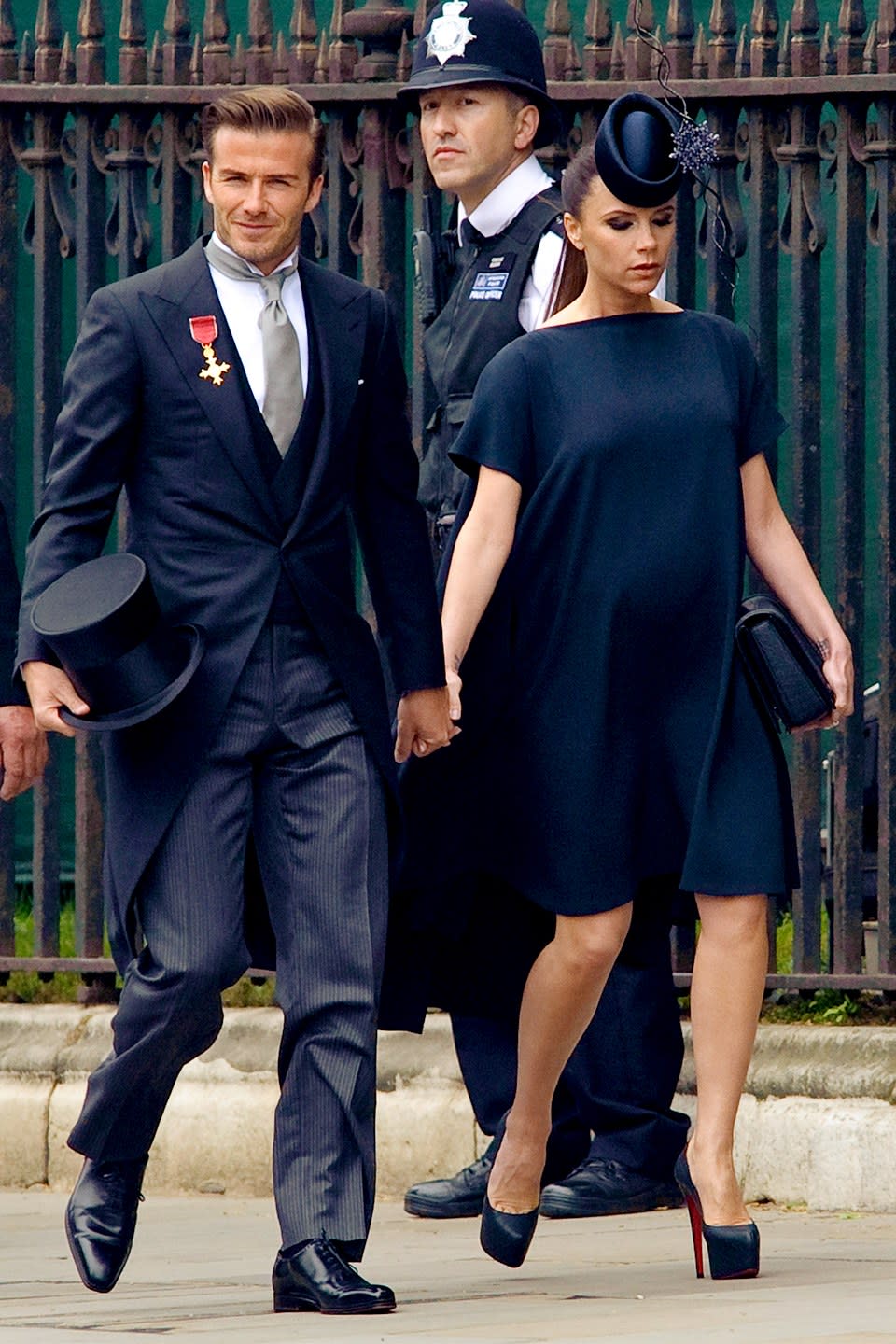 A pop star, a footballer, and their hats. Victoria Beckham was pregnant with their fourth child, <strong>Harper,</strong> when she attended Prince William’s wedding, and paired the famous milliner <strong>Philip Treacy</strong> design with one of her own. David wore Ralph Lauren and majorly goofed by wearing his O.B.E. medal on the wrong lapel. The horror!