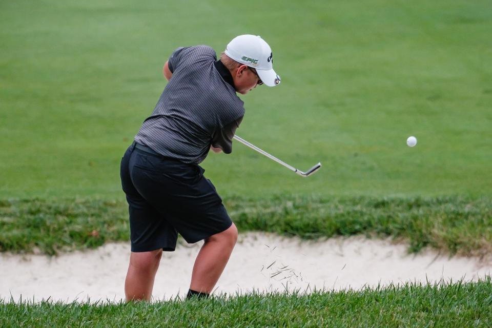 TCC's Nick Williams hits out of a bunker during the Tuscarawas Central Catholic Cibo's Invitational, Wednesday, Aug. 10 at Union Country Club in Dover.