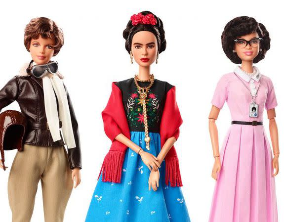 Frida Kahlo, Amelia Earhart, and Katherine Johnson Barbie dolls.