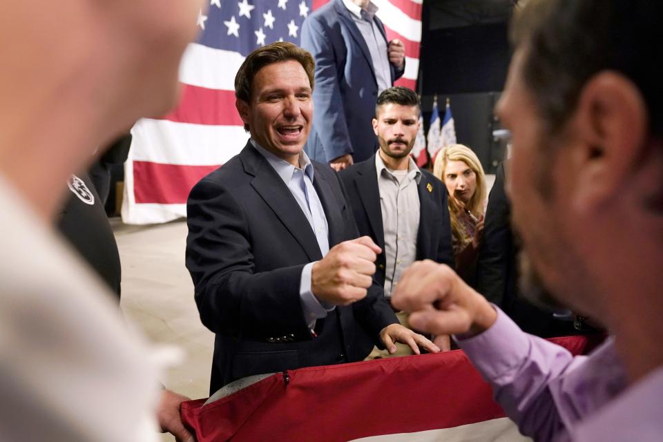 Republican presidential candidate Gov. Ron DeSantis greets audience members during a campaign event on May 30 in Iowa.