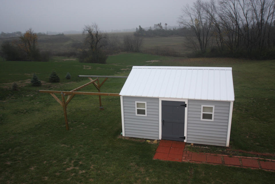 This Oct. 23, 2012 photo provided by Scott Jamieson shows Jamieson's home observatory when it is not in use in Eagle, Wis. The roof rolls onto support beams to give him a view of the entire night sky. (AP Photo/Scott Jamieson, Scott Jamieson)