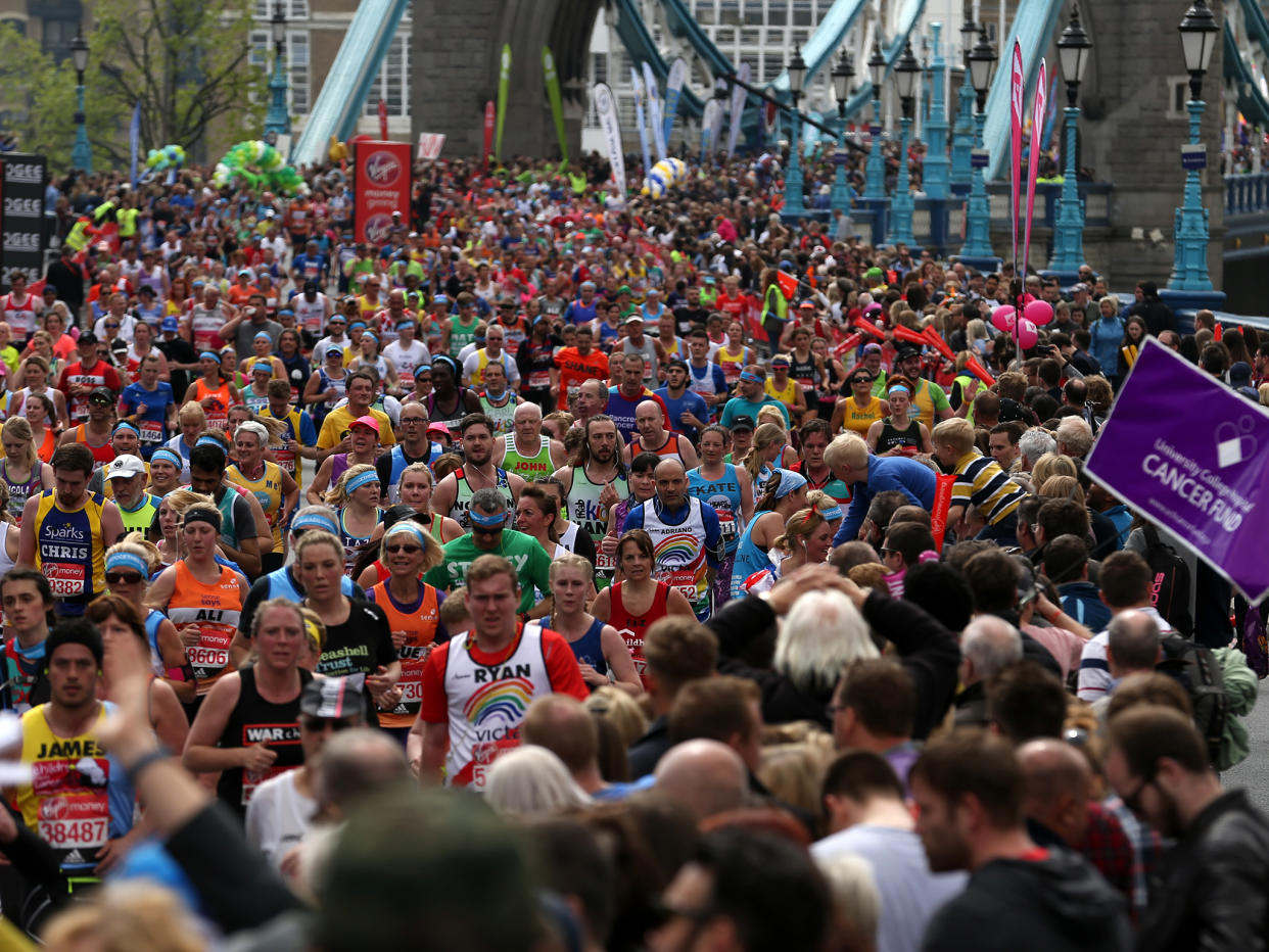 Runners make their way off Tower Bridge during the Virgin Money London Marathon, London: PA