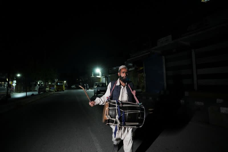 Kashmiri Ramadan drummers wake Muslims up for their meal before daybreak, in Srinagar