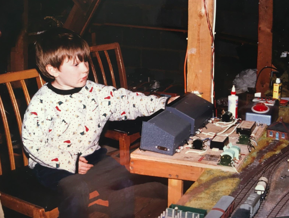 <em>Peter Hurst’s grandson Harvey playing with Peter’s model railway (SWNS)</em>