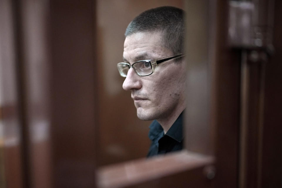 Robert Woodland, a Russia-born U.S. citizen, stands in a glass cage during a court hearing, Thursday, July 4, 2024, in Moscow, Russia. Woodland was convicted of drug-related charges and sentenced to 12 and a 1/2 years in prison on Thursday. (AP Photo/Alexander Zemlianichenko)