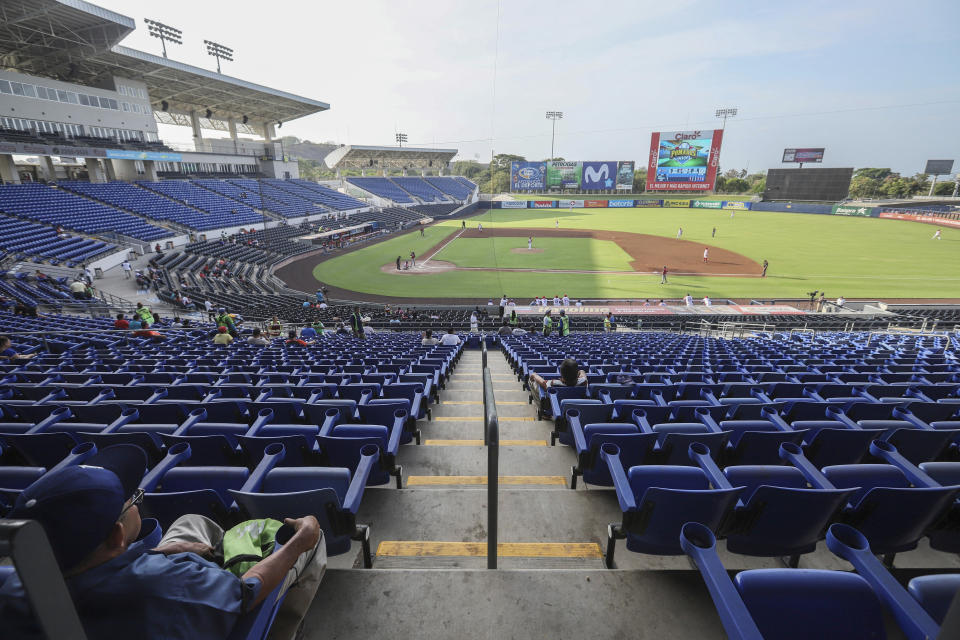 A man watches a professional baseball game between Boer de Managua and Flecheros de Matagalpa at Dennis Martinez stadium in Managua, Nicaragua, Saturday, April 25, 2020. As the new coronavirus spread and economies shut across Latin America, Nicaragua stayed open _ schools, stores, concert halls, and baseball stadiums, all operating uninterrupted on orders of a government that denied the gravity of the disease. (AP Photo/Alfredo Zuniga)