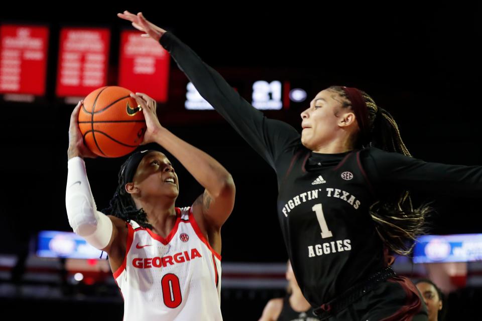 Georgia forward Zoesha Smith (0) looks to shoot while being grounded by Texas A&M guard Endyia Rogers (1) during a NCAA women's college basketball game between Texas A&M and Georgia in Athens, Georgia, on Thursday, Jan. 4, 2024.