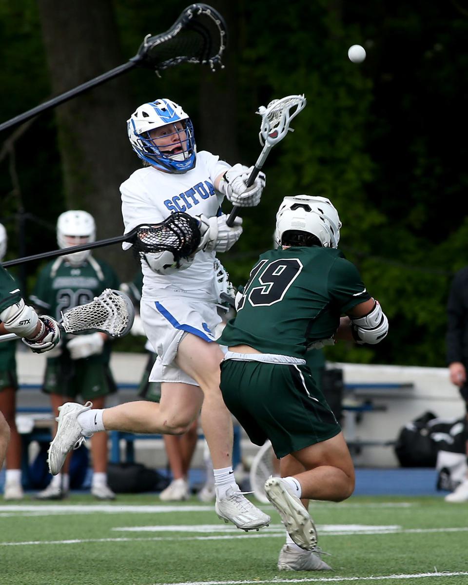 Scituate's Willie Robinson leaps up to score to cut Minnechaug’s lead to 9-6 during third quarter action of their game against Minnechaug in the Division 2 Sweet 16 game at Scituate High School on Thursday, June 8, 2023. Scituate would lose to Minnechaug 12-10.