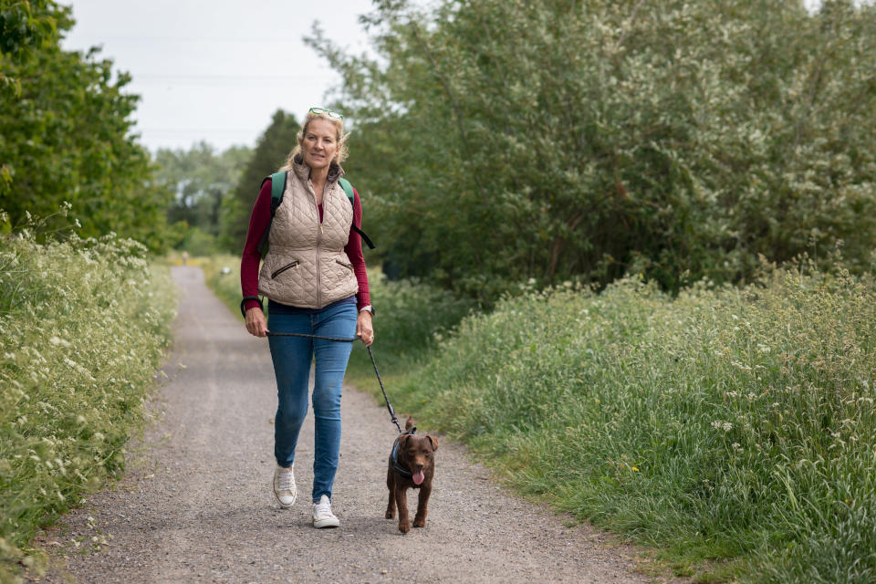 A woman walking her dog