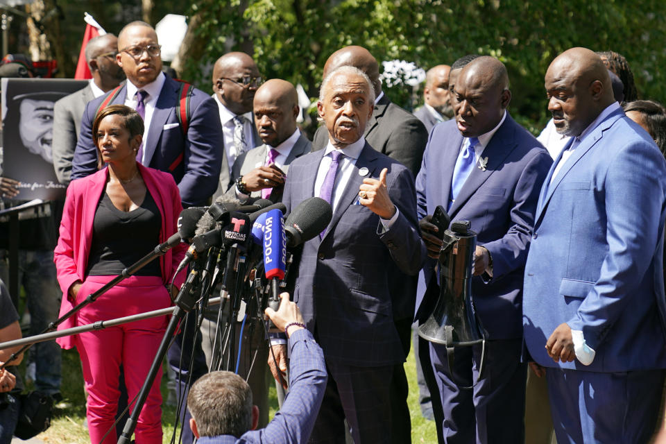 The Rev. Al Sharpton, center, address a news conference with attorneys and George Floyd family members after former Minneapolis police officer Derek Chauvin was sentenced to 22 1/2 years in prison, Friday, June 25, 2021 in Minneapolis murder in the May, 2020 death of George Floyd during an arrest in Minneapolis. To Sharpton's left is Floyd family attorney Ben Crump. (AP Photo/Jim Mone)