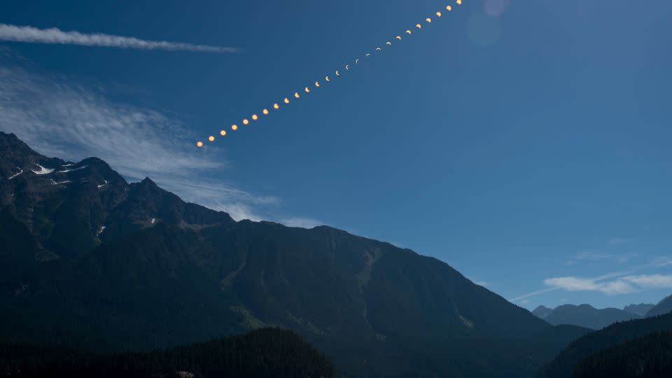 This composite image shows the progression of a partial solar eclipse over Ross Lake in Northern Cascades National Park in Washington on August 21, 2017. - Bill Ingalls/NASA