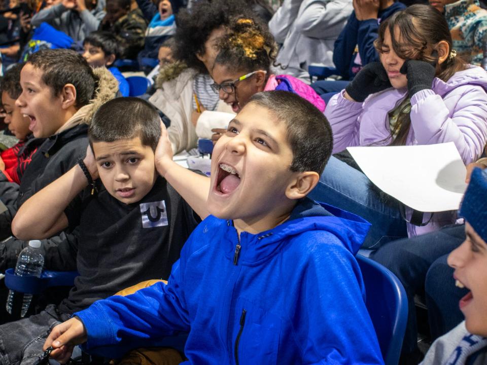 Students from Clark Street School make noise for the Railers as hundreds of Worcester Public Schools students attend a morning hockey game at the DCU Center Wednesday, November 29, 2023.