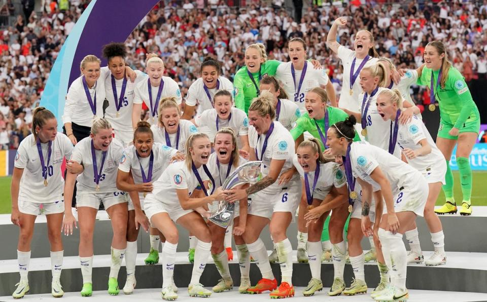 England’s Leah Williamson and Millie Bright lift the Euro 2022 trophy (Jonathan Brady/PA) (PA Wire)