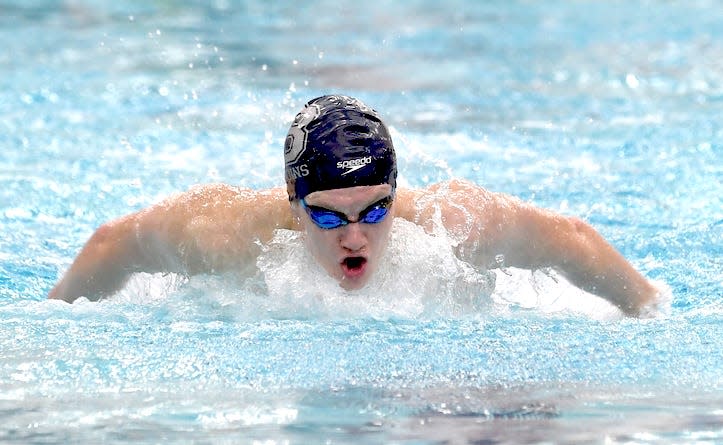 Bartlesville High School Griffin Craig, who is the defending state champion in the boys 100 backstroke, makes a strong move in the Phillips Aquatic Center pool during prep competition on Nov. 2, 2023.