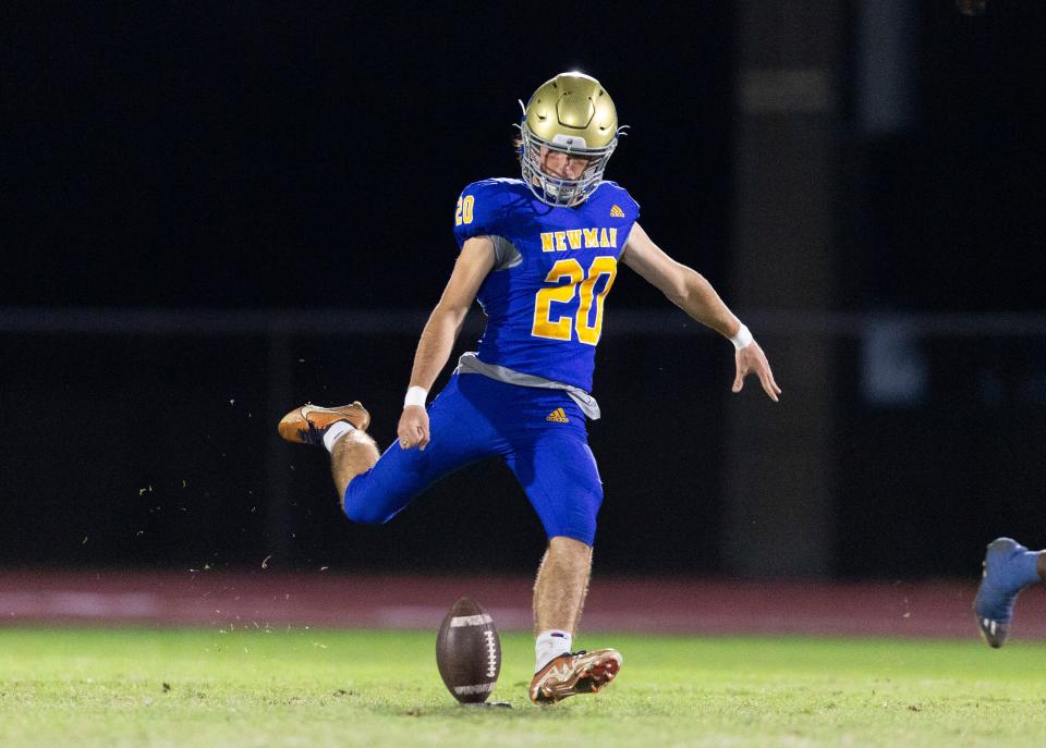Cardinal Newman Jack Beylo kicks off against Benjamin during their regional semifinal playoff football game in West Palm Beach on November 17, 2023.