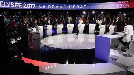 Candidates attend a prime-time televised debate for the French 2017 presidential election in La Plaine Saint-Denis, near Paris, France, April 4, 2017. REUTERS/Lionel Bonaventure