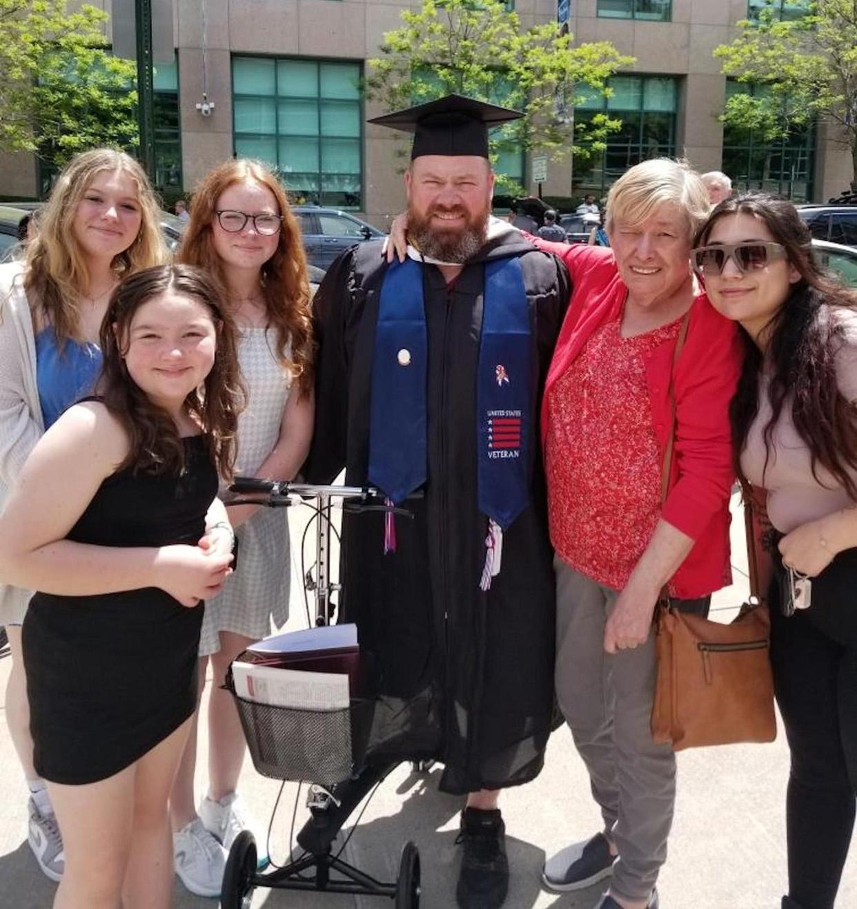 Brian Goodhart with his family on graduation day at Rhode island College last month. From left, daughters Jacey, Chloe, and Aundrea. On Brian's right are his mother, Barbara Gagne, and stepdaughter Alexis.