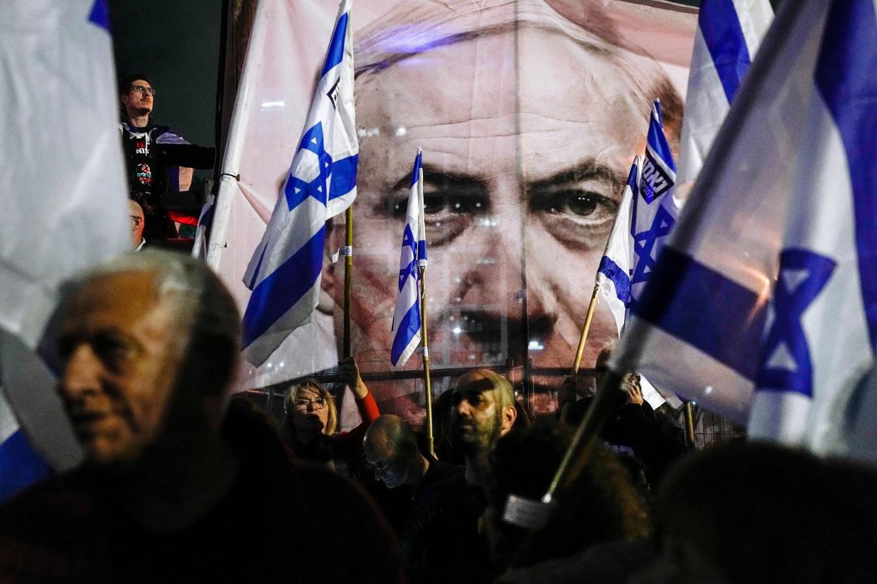 Israelis protest against plans by Prime Minister Benjamin Netanyahu's government to overhaul the Israel's judicial system, in Tel Aviv, Israel (Copyright 2023 The Associated Press All rights reserved)