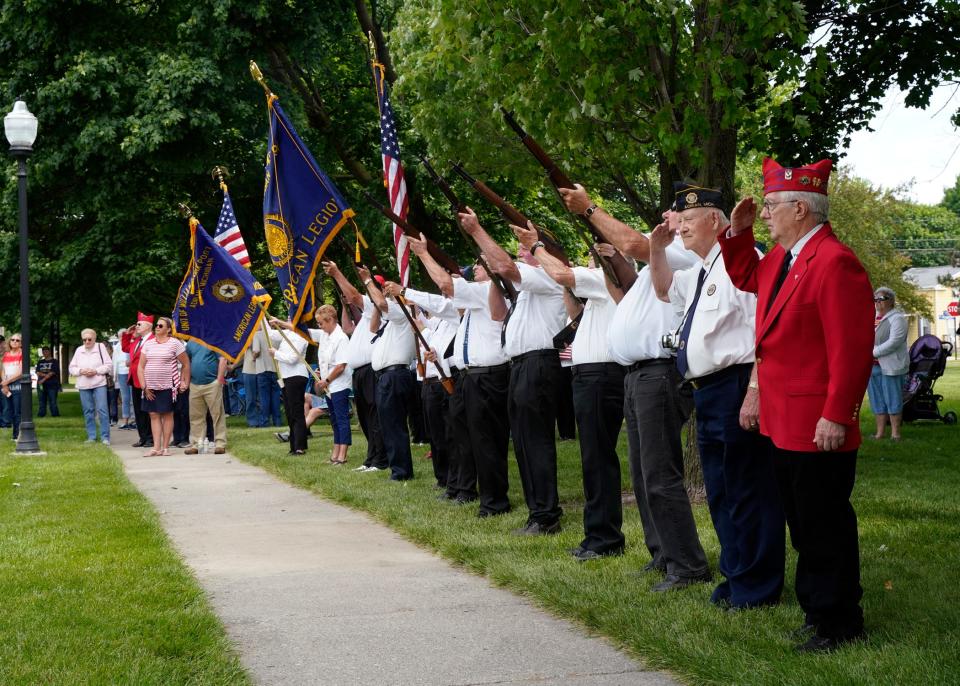 Color guard members from American Legion Post No. 97 in Adrian prepare to fire a 21-gun salute during Adrian's Memorial Day ceremony at Monument Park, May 31, 2021.