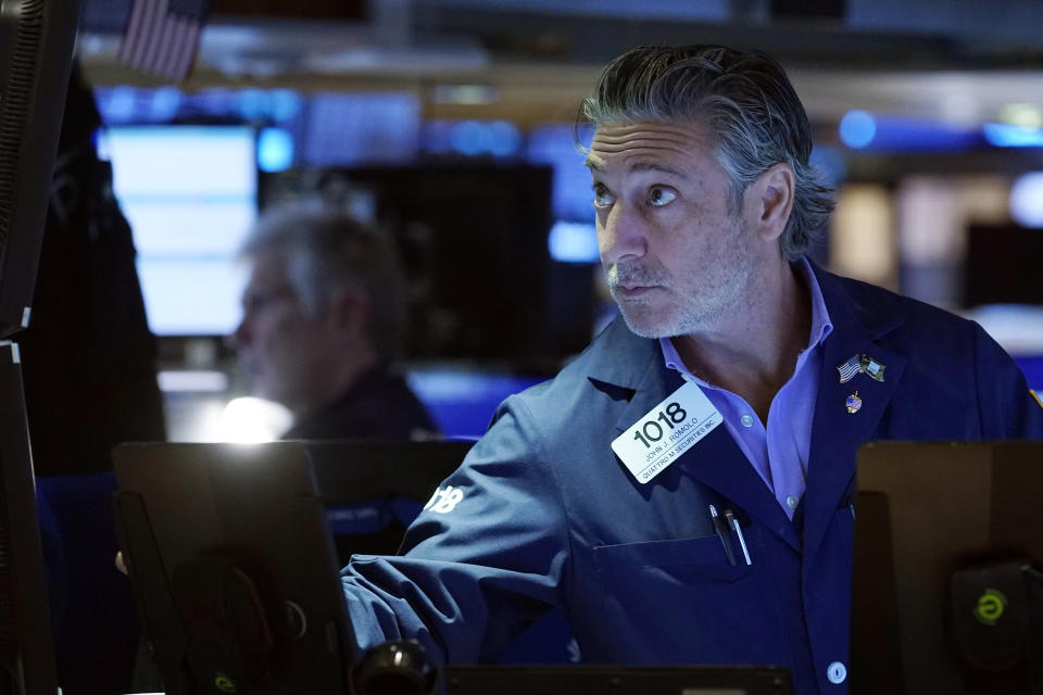 Trader John Romolo works on the floor of the New York Stock Exchange, Friday, Aug. 25, 2023. (AP Photo/Richard Drew)