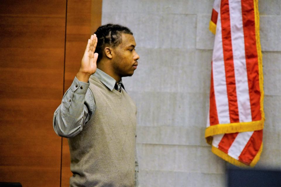 Kyrique Camper, 20, takes the oath to tell the truth before taking the stand to testify in his own defense Dec. 13, 2023, during his murder trial in Franklin County Common Pleas Court. Camper testified he was afraid he was about to be killed when he saw a shadowy figure through his tinted windows approaching his vehicle, so he shot 17-year-old A'niyah Elie not knowing who it was. A jury acquitted Camper of murder and found him guilty of improperly handling a firearm in a motor vehicle, for which he received two years of probation.