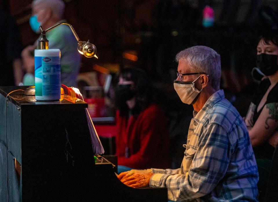 Music director Michael Reno plays the piano during a rehearsal for "Fun Home" at the Coachella Valley Repertory in Cathedral City, Calif., Friday, Dec. 2, 2022. 