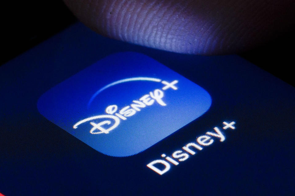 BERLIN, GERMANY - APRIL 22: The logo of the online video library Disney+ is shown on the display of a smartphone on April 22, 2020 in Berlin, Germany. (Photo by Thomas Trutschel/Photothek via Getty Images)