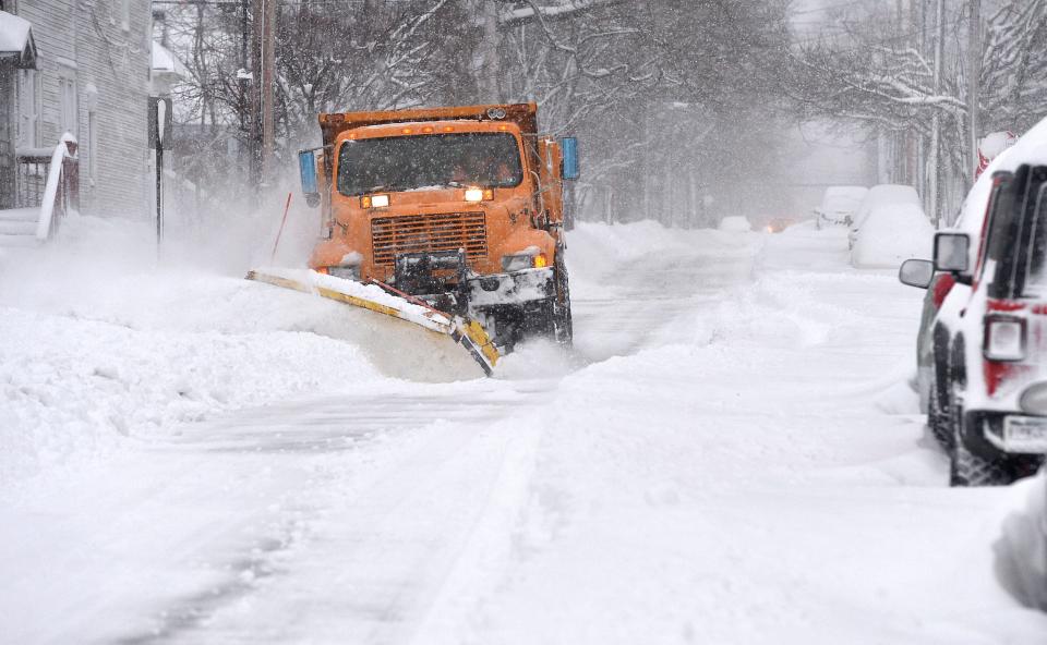 A City of Erie Streets Department plow truck clears more than a foot of snow, Jan. 17, 2022, from the northbound lane of the 100 block of Myrtle Street. A lake-effect weather system dumped heavy snow across the Erie region.