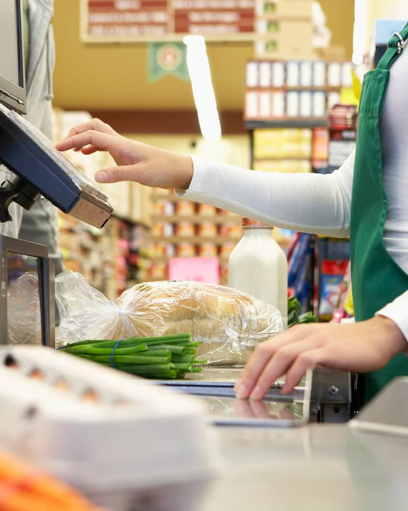 Cashier ringing up groceries