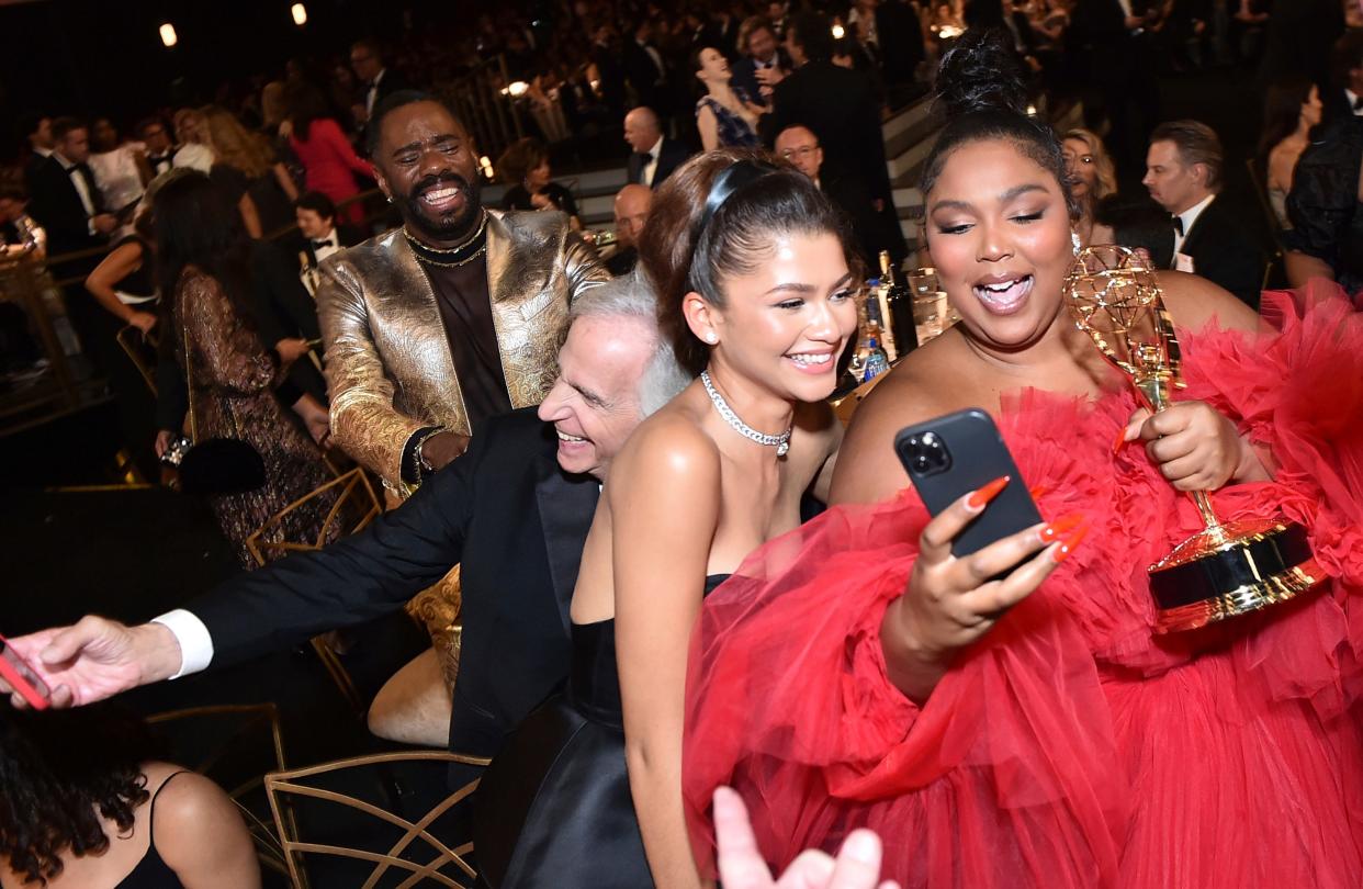 Zendaya, from left, and Lizzo, winner of the Emmy for outstanding competition program for "Lizzo's Watch Out For The Big Grrrls" at the 74th Emmy Awards on Monday, Sept. 12, 2022, at the Microsoft Theater in Los Angeles.