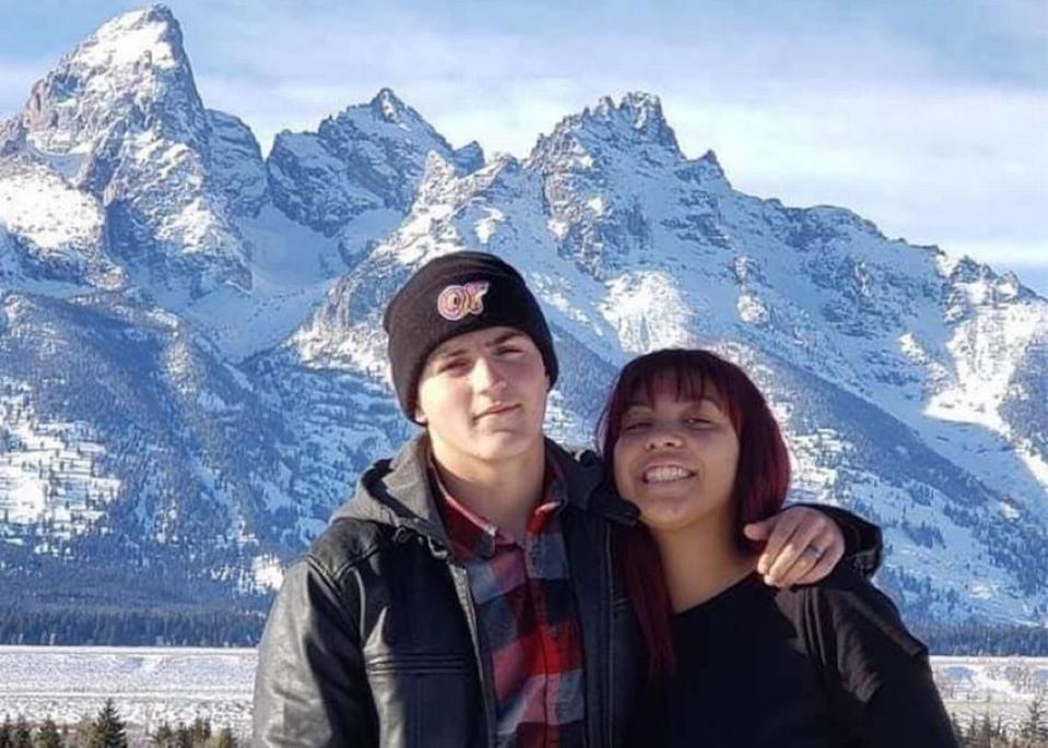 Rylee McCollum and his wife, Gigi, in front of the Tetons. Gigi is pregnant with their first child.
