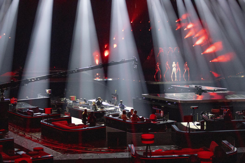 In this photo taken on May 12, 2021, the waiting booths of performing artists are seen in the foreground during rehearsals at the Eurovision Song Contest at Ahoy arena in Rotterdam, Netherlands. After last year's Eurovision Song Contest was canceled amid the global COVID-19 pandemic, it is roaring back to life with coronavirus bubbles added to its heady mix of music and camp. (AP Photo/Peter Dejong)