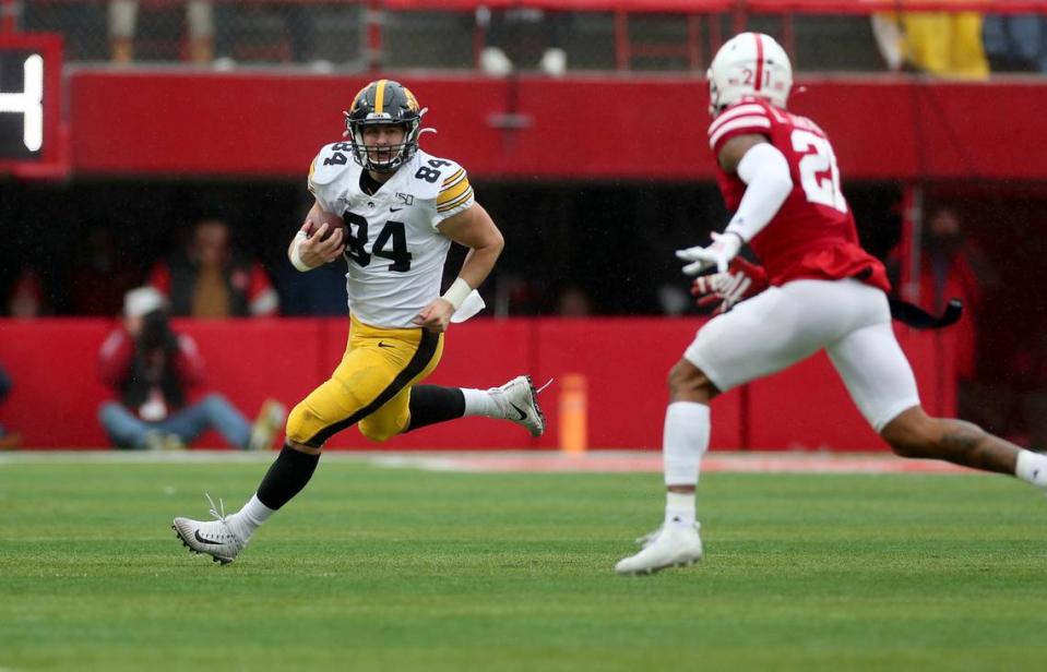 Iowa Hawkeyes tight end Sam LaPorta (84) carries the ball against the Nebraska Cornhuskers during a game in 2019 Memorial Stadium in Lincoln, Nebraska. The Highland High School graduate is now preparing for the NFL draft.