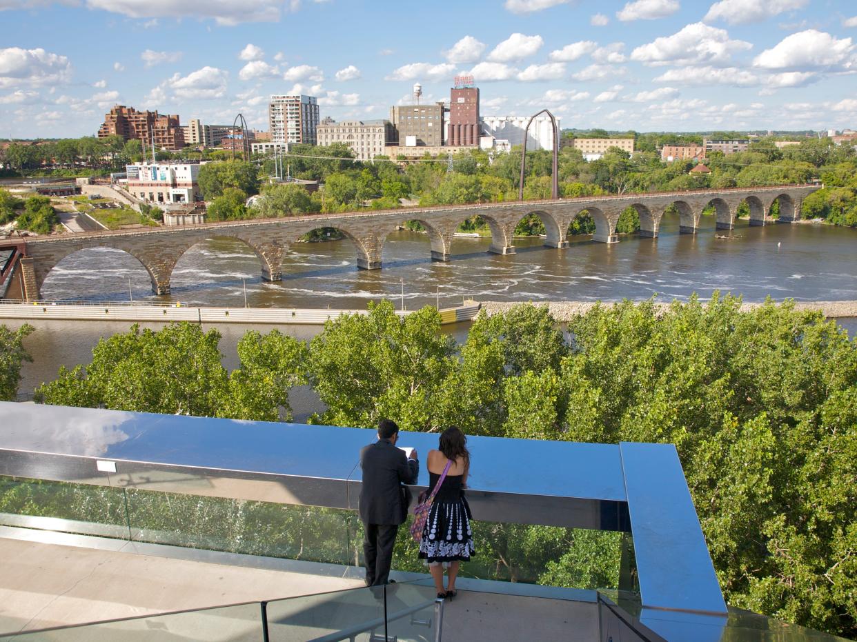 View of the Mississippi River and Stone Arch Bridge from balcony of the Guthrie Theater in Minneapolis, MN.
