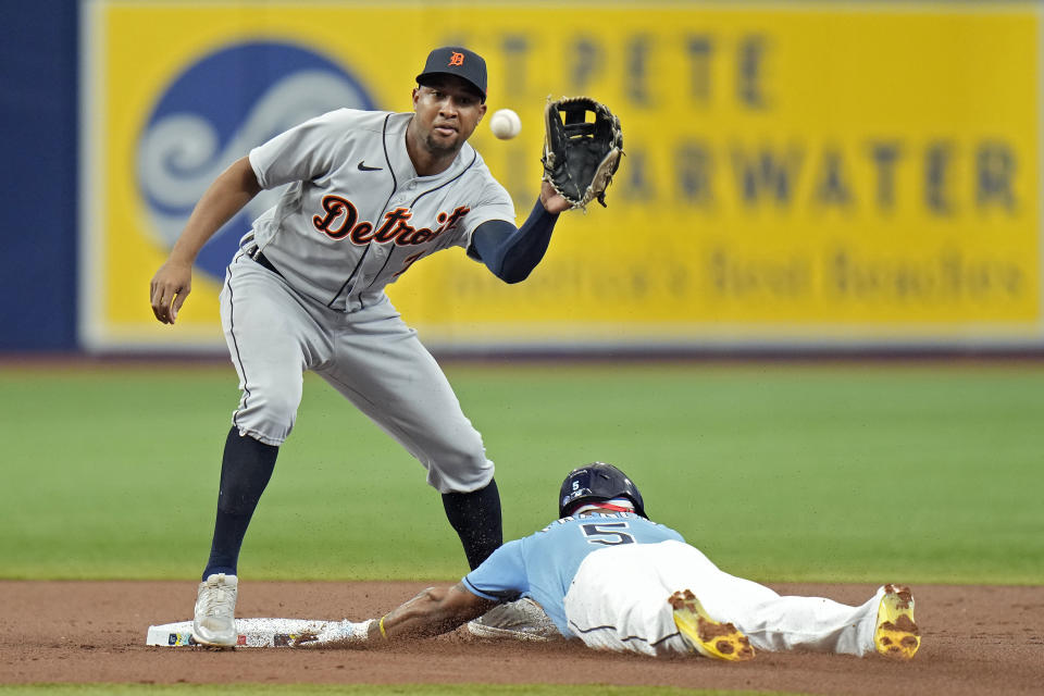 Tampa Bay Rays' Wander Franco (5) steals second base ahead of the throw to Detroit Tigers' Jonathan Schoop during the first inning of a baseball game Sunday, April 2, 2023, in St. Petersburg, Fla. (AP Photo/Chris O'Meara)