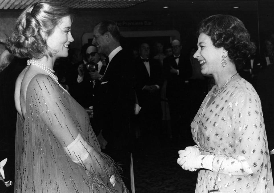 <p>A pregnant Cybill Shepherd wears a sheer flowing gown, that was quite daring for the time, to meet Queen Elizabeth II.</p>