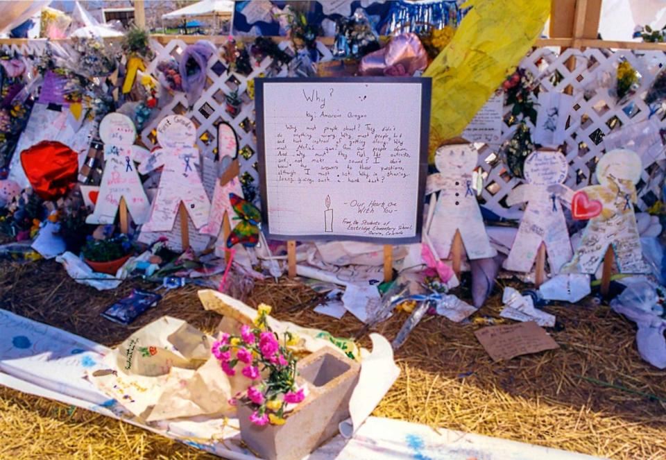 PHOTO: View of flowers and tokens left at a makeshift memorial in remembrance of 13 victims at Columbine High School, Littleton, Colorado, April 21, 1999. (Howard Ruffner/Getty Images, FILE)