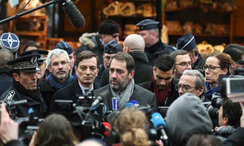 Christophe Castaner talks to the press during the reopening of the market