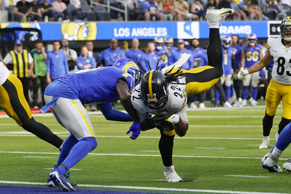 Pittsburgh Steelers running back Najee Harris, right, scores a touchdown as Los Angeles Rams safety Jordan Fuller defends during the second half of an NFL football game Sunday, Oct. 22, 2023, in Inglewood, Calif. (AP Photo/Gregory Bull)
