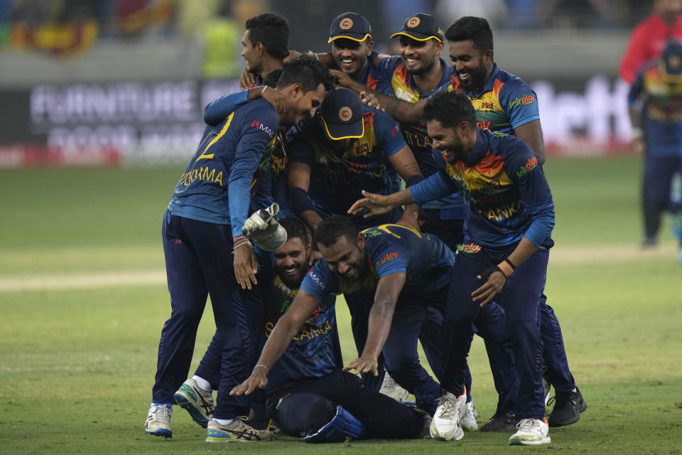 Sri Lankan players celebrate after their win in the T20 cricket Asia Cup final match against Pakistan, in Dubai, United Arab Emirates, Sunday, Sept. 11, 2022. (AP Photo/Anjum Naveed)