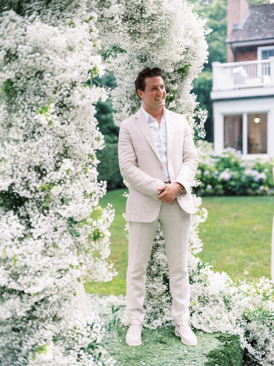 The Bride and Groom Said Their Vows Beneath a Floral Chuppah at This Hamptons Backyard Wedding