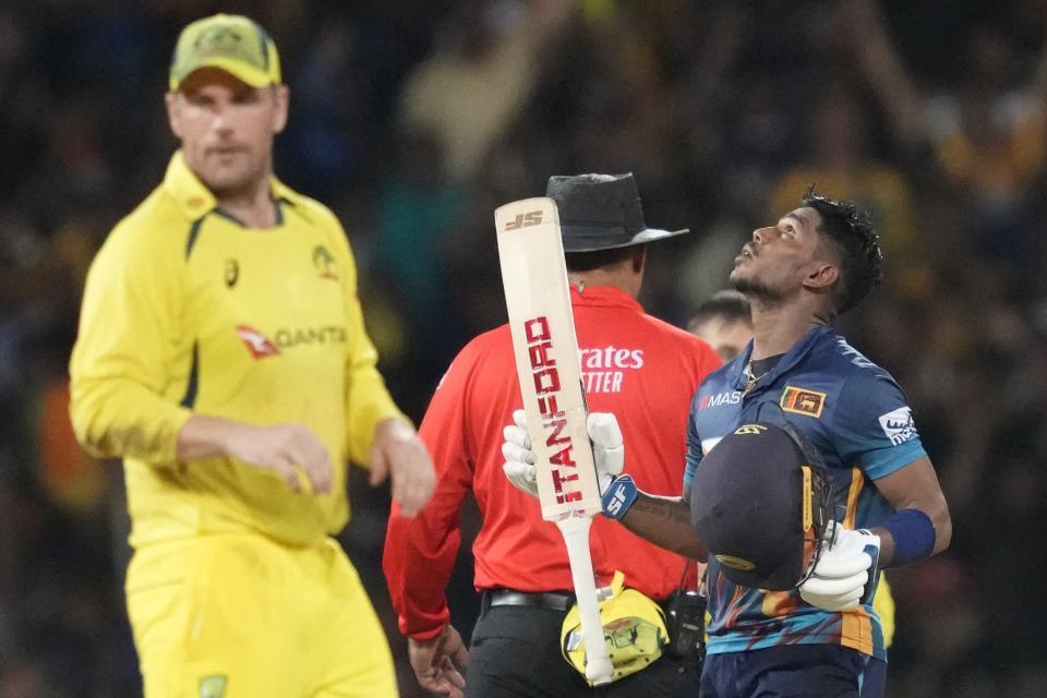 Sri Lanka's Pathum NIssanka celebrates scoring a century during the third one-day international cricket match between Australia and Sri Lanka in Colombo, Sri Lanka, Sunday, June 19, 2022. (AP Photo/Eranga Jayawardena)