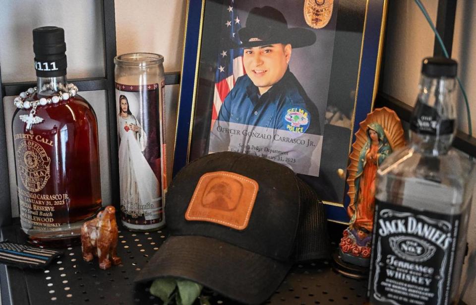A shrine to Gonzalo Carrasco Jr sits on a shelf at Karla Alvarez’s home in Dinuba on Tuesday, May 9, 2023. Alvarez was nine-months pregnant when Carrasco was killed in the line of duty last January 31, 2023. CRAIG KOHLRUSS/ckohlruss@fresnobee.com