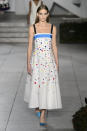 <p><i>A model wears a white, confetti-decorated dress from the SS18 Carolina Herrera dress. (Photo: IMAXtree) </i></p>