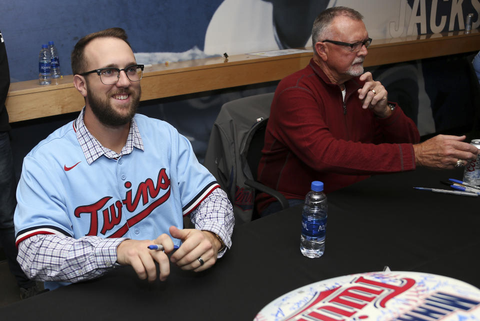 Minnesota Twins' Randy Dobnak smiles while giving autographs at the baseball team's TwinsFest, Friday, Jan. 24, 2020, in Minneapolis. The Twins remain publicly confident in the rotation anchored by returning veterans Jose Berrios and Jake Odorizzi and supplemented by youngsters like Devin Smeltzer, Dobnak and Lewis Thorpe. (AP Photo/Stacy Bengs)