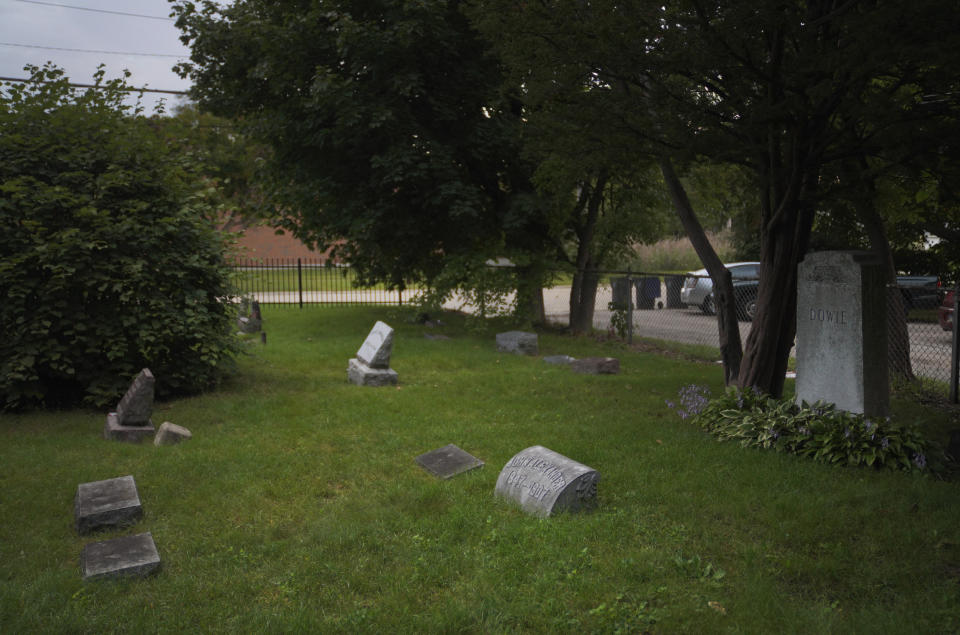 John Alexander Dowie is laid to rest near his wife and two children at Lake Mound Cemetery in Zion, Ill., as seen on Saturday, Sept. 17, 2022. (AP Photo/Jessie Wardarski)